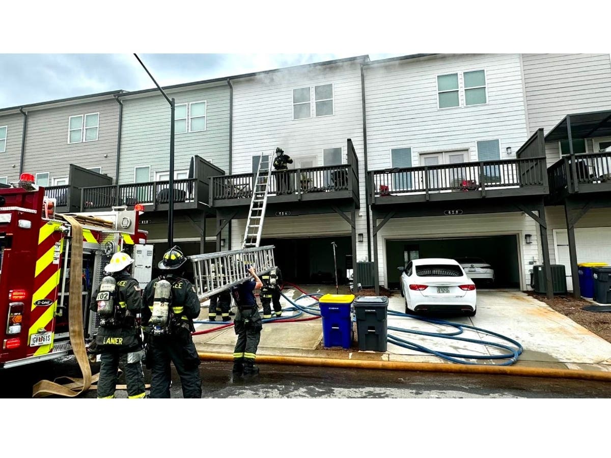 Cherokee County firefighters respond Wednesday to a townhouse fire at Tiller Way.