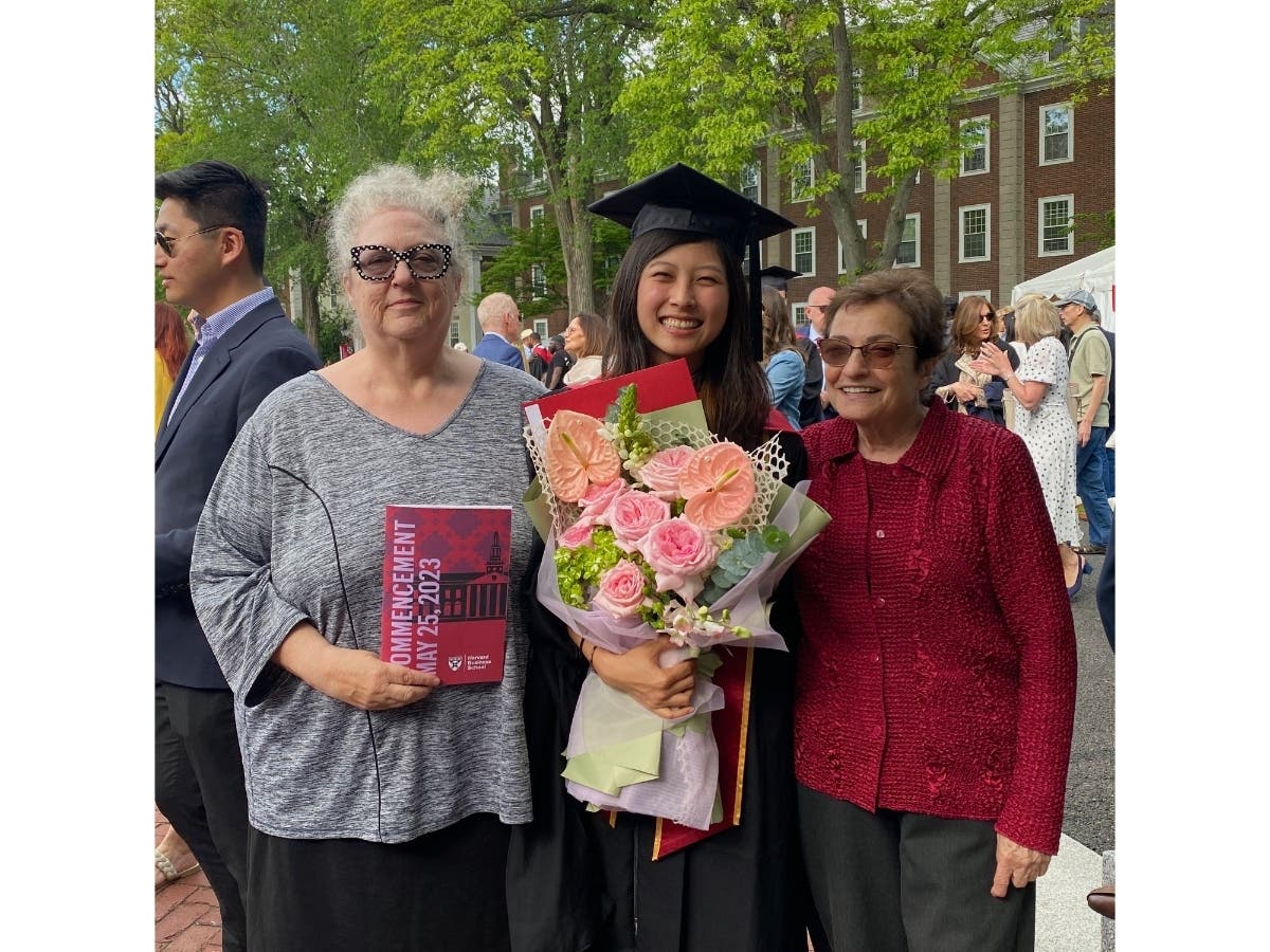 Yiping Zhang (center) poses for a commencement photo with her Brookline "honorary grandparents," Lee Goldberg (left) and Marcia Levine (right). 