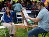 Greysdi Melgar, a student at New Brunswick Health Sciences Technology High School, gets her caricature drawn by Matt Many at Voorhees Mall.