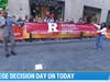 Today Show news anchor Craig Melvin (left) helps Old Bridge High School senior Lola Adeleye make her surprise announcement on College Decision Day.