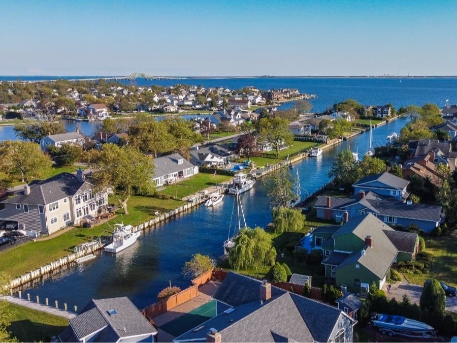 West Islip Waterfront Wonders: A Tale of Two Homes