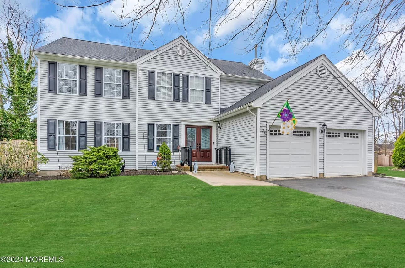 One-of-a-Kind Gorgeous Colonial with an In Law Suite in Desirable Country Woods!