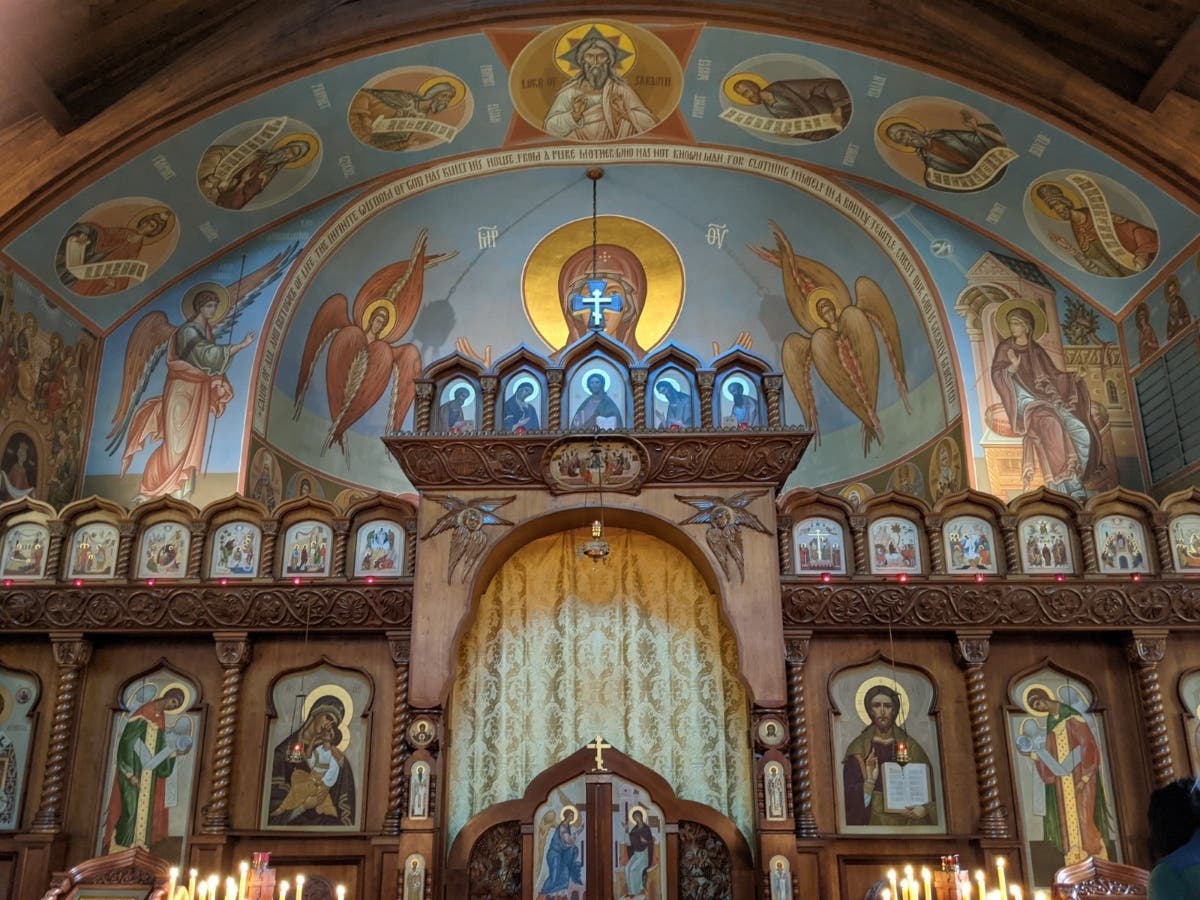 The Iconostasis (icon screen) before the altar at Holy Trinity Church.  It exists to show our unity with Christ and all the angels and saints.