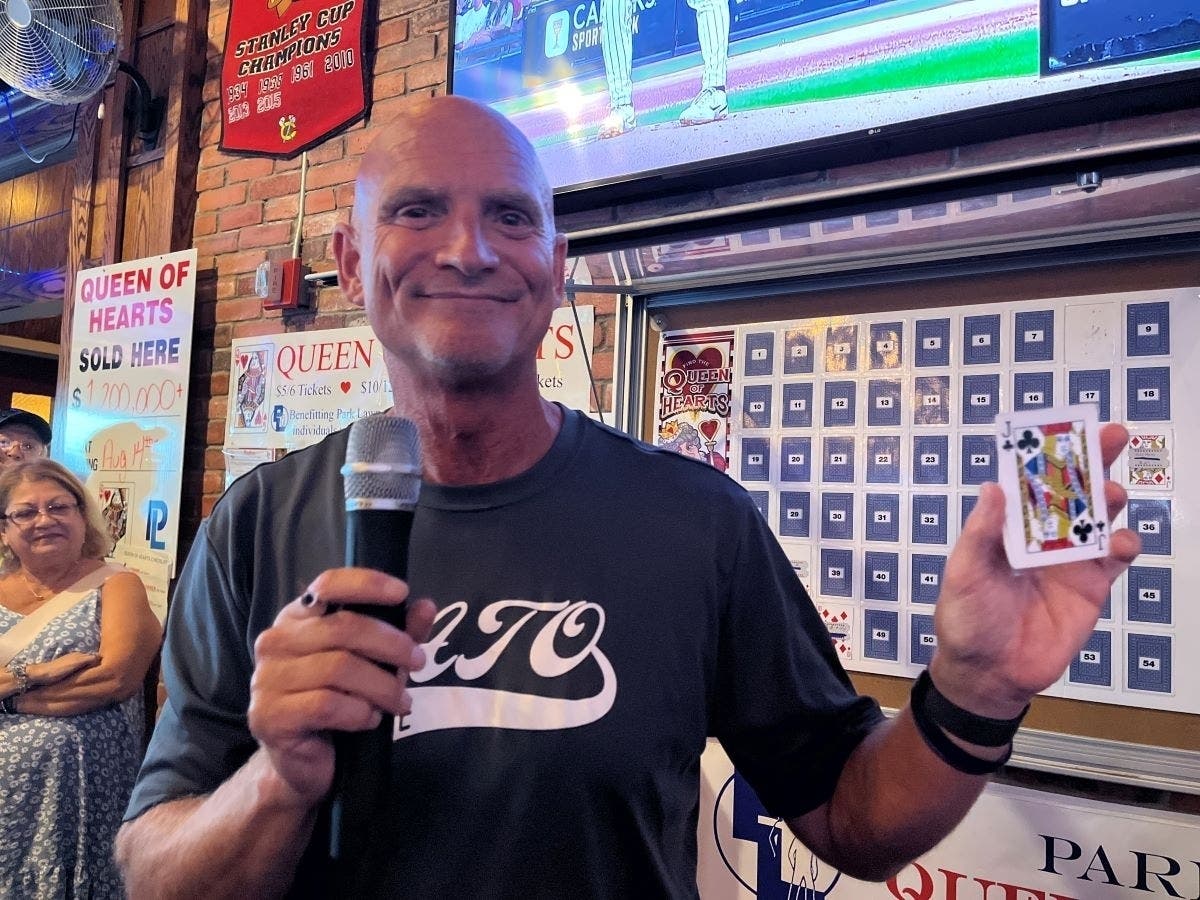 The intrepid Tim Newsome, owner of ATO, holds the jack of clubs from the Aug. 14 drawing in the Park Lawn Queen of Hearts Raffle. 