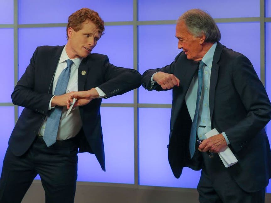 Rep. Joe Kennedy III and Sen. Ed Markey "elbow bump" before a debate