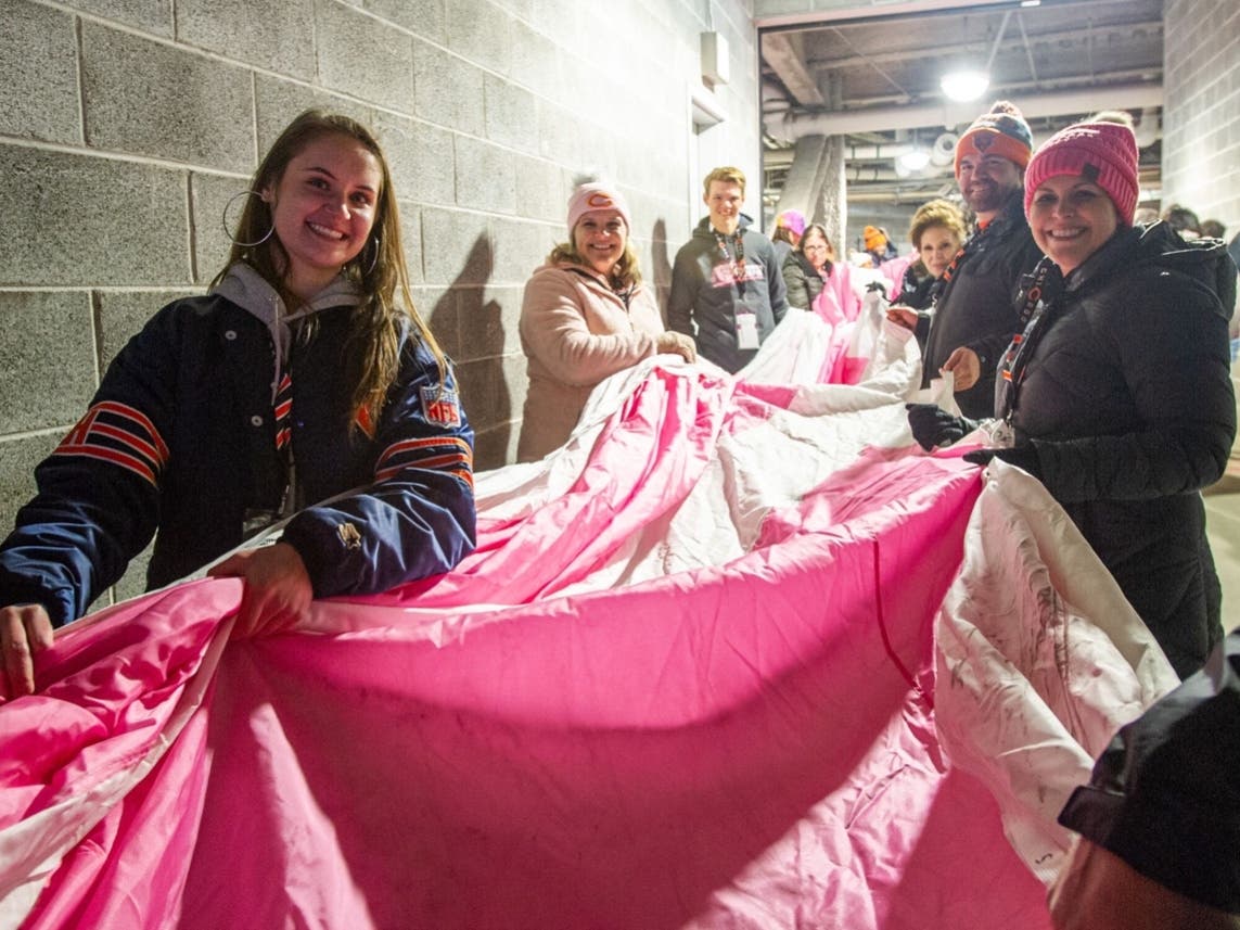 Prior to kick-off, patients unfurled a ceremonial pink ribbon, and during halftime, two patients and their care teams participated in an on-field Punt, Pass, and Kick competition.​
