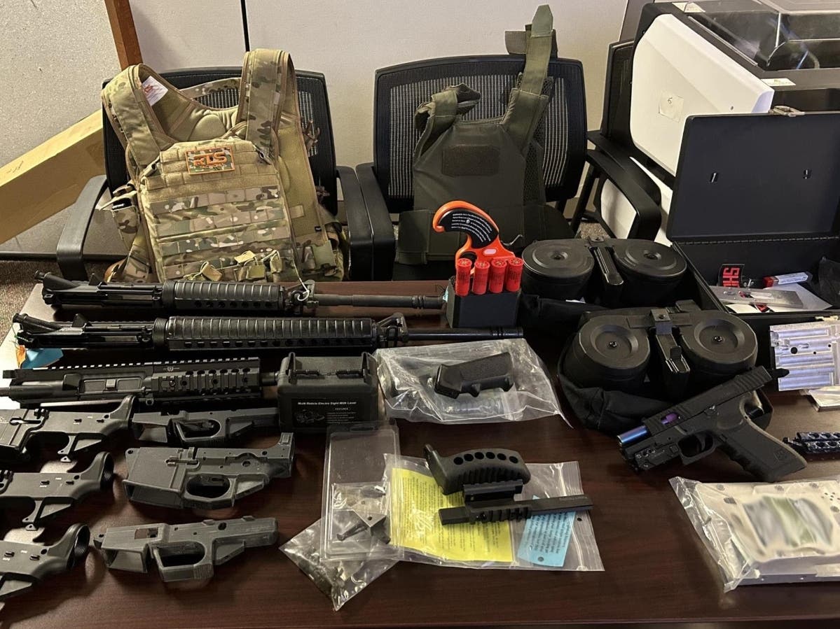 A 39-year-old felon suspected of possessing over 35 rifles and handguns and committing other crimes was arrested in an unincorporated area bordering Vista, authorities said.