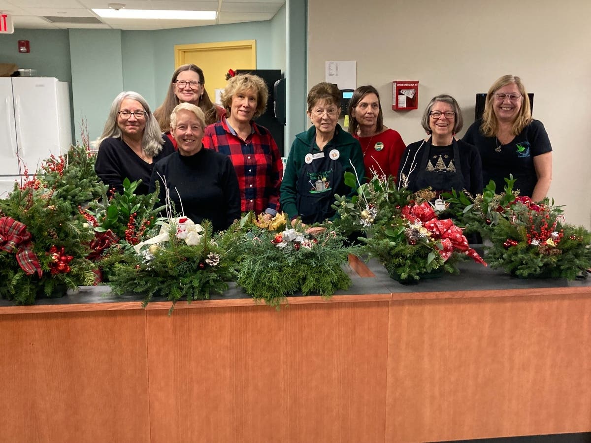 Members of the Brewster-Carmel Garden Club made holiday centerpieces for 17 lucky supporters of the Kent Library.