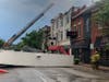 City crews were on the scene Sunday morning amid a building collapse caused by a severe storm on Joliet's Cass Street.