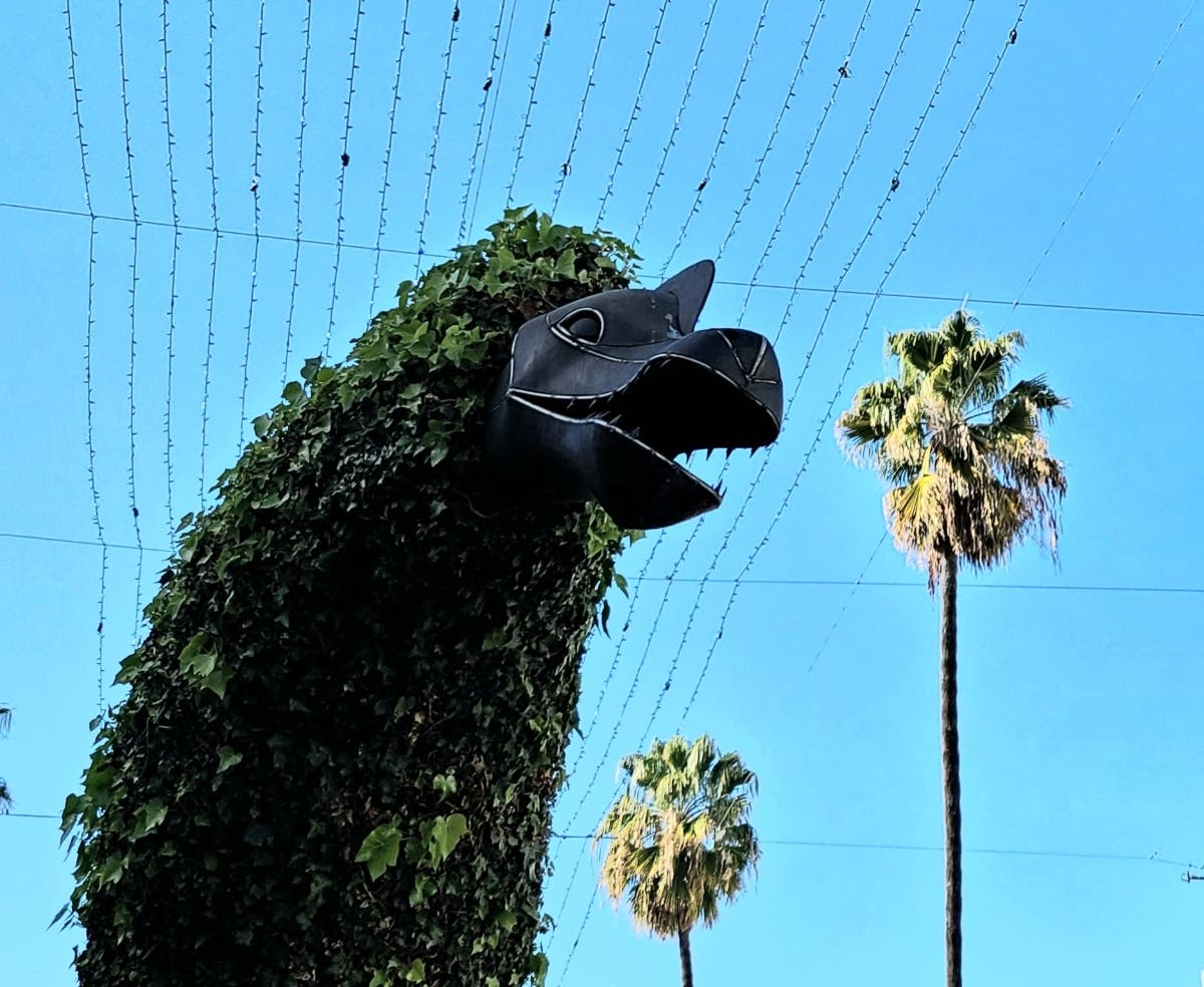 Dinosaur topiaries are featured under the lights and palm trees at Third Street Promenade.