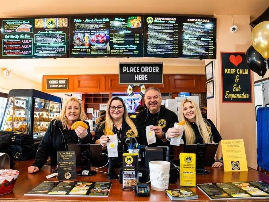 The Pelaez family poses at the newest Island Empanada in Oakdale during a Greater Sayville Chamber of Commerce ribbon cutting.