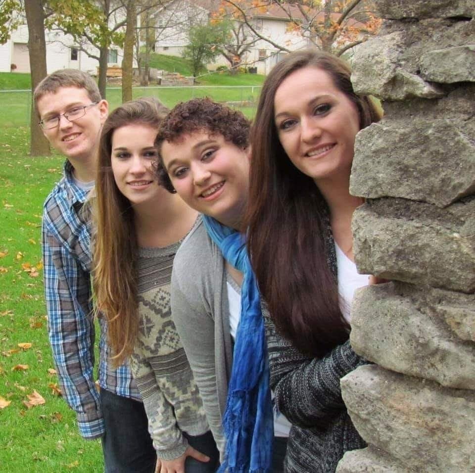 Daniel James Richards, left, pictured with his three sisters, killed himself to escape bullying, his family said.