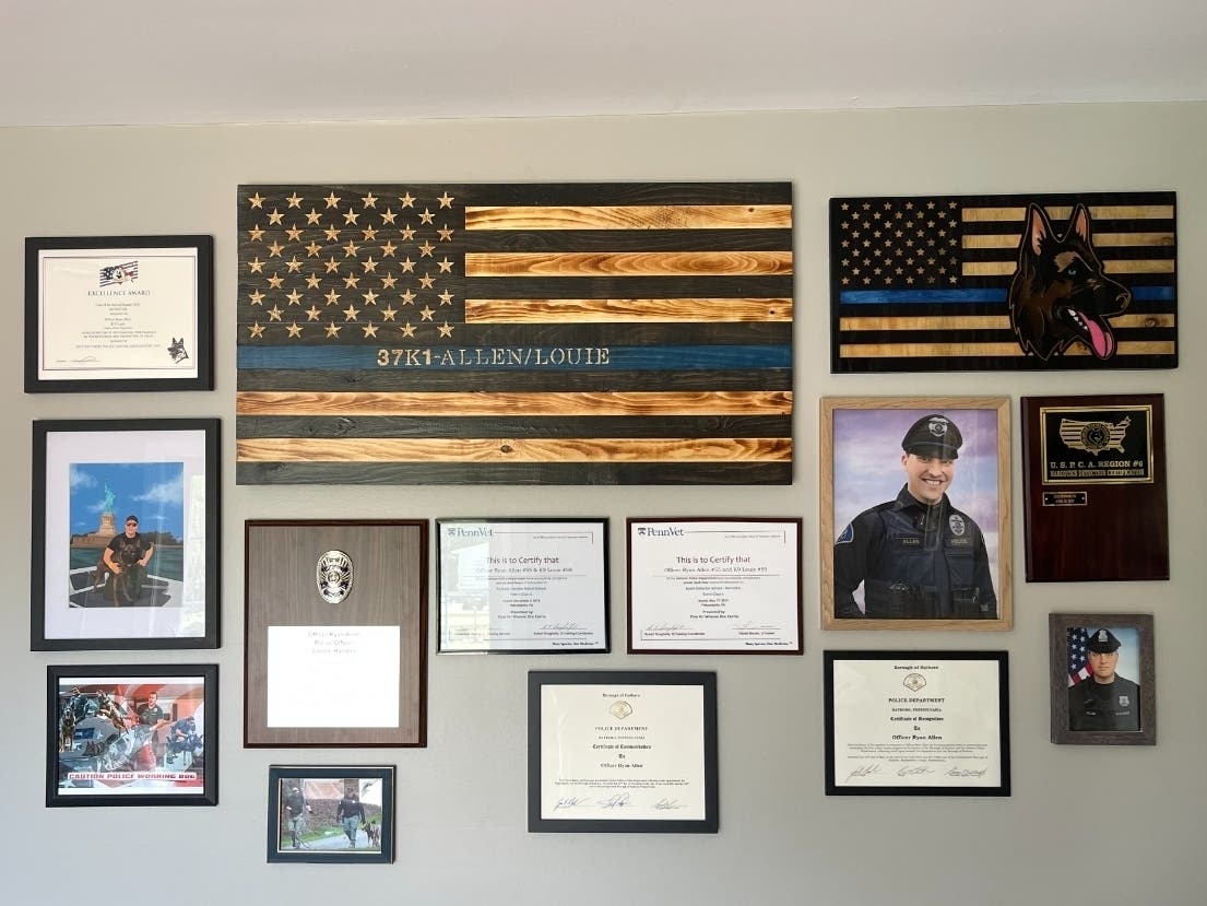 A memorial wall dedicated to the late Ryan Allen is displayed in the Allen home in Bucks County. Allen, a K9 officer with the Hatboro Police Department in Montgomery County, died in April. 