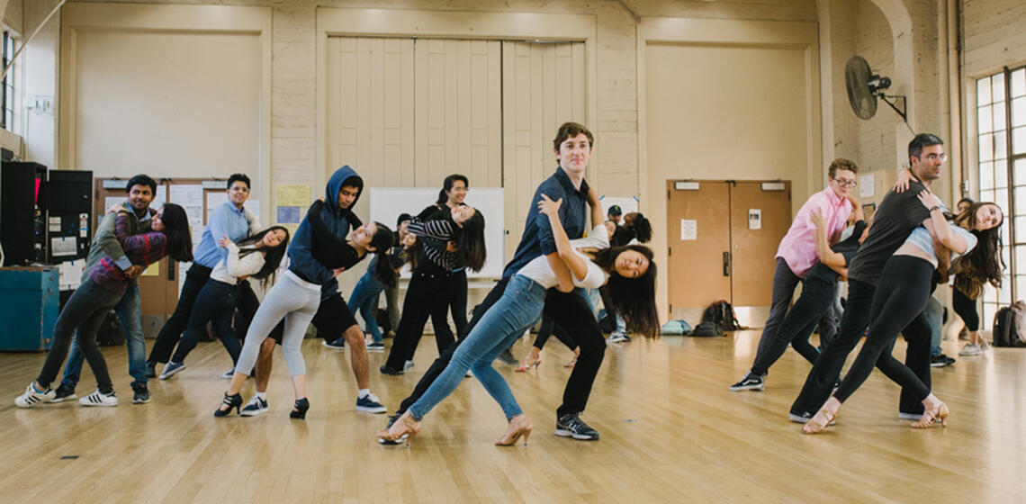 Students partner dancing