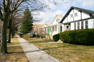 
[image ALT: One side of a residential street, with its sidewalk, extending 200 meters to the background: lawns and barren trees, and low single-story and two-story houses with pitched roofs. It is a view of the 1700 block of West Arthur Avenue in Chicago, Illinois.]
			