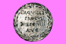 
[image ALT: A round metal plaque with an inscription. It is a phalera, a Roman military decoration. On this site, it serves as the icon for the works of Tacitus.]