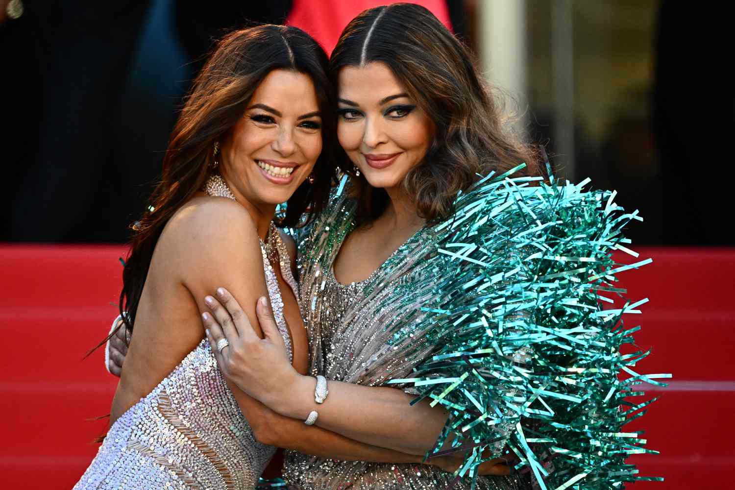 Aishwarya Rai Bachchan (R) pose with US actress, producer, director Eva Longoria as they arrive for the screening of the film "Kinds Of Kindness" at the 77th edition of the Cannes Film Festival in Cannes, 