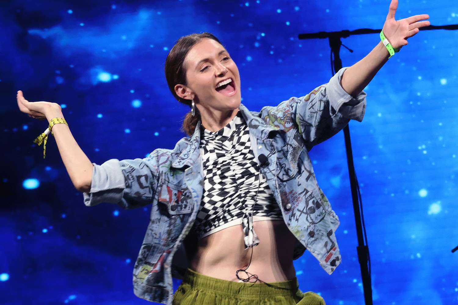 Alyson Stoner appears on stage at 2022 VidCon at the Anaheim Convention Center on June 23, 2022