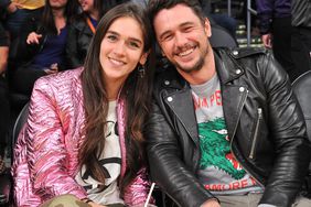 Isabel Pakzad and James Franco attend a basketball game between the Los Angeles Lakers and the Golden State Warriors in 2019