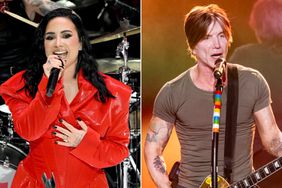  Demi Lovato performs onstage; John Rzeznik of the Goo Goo Dolls performs