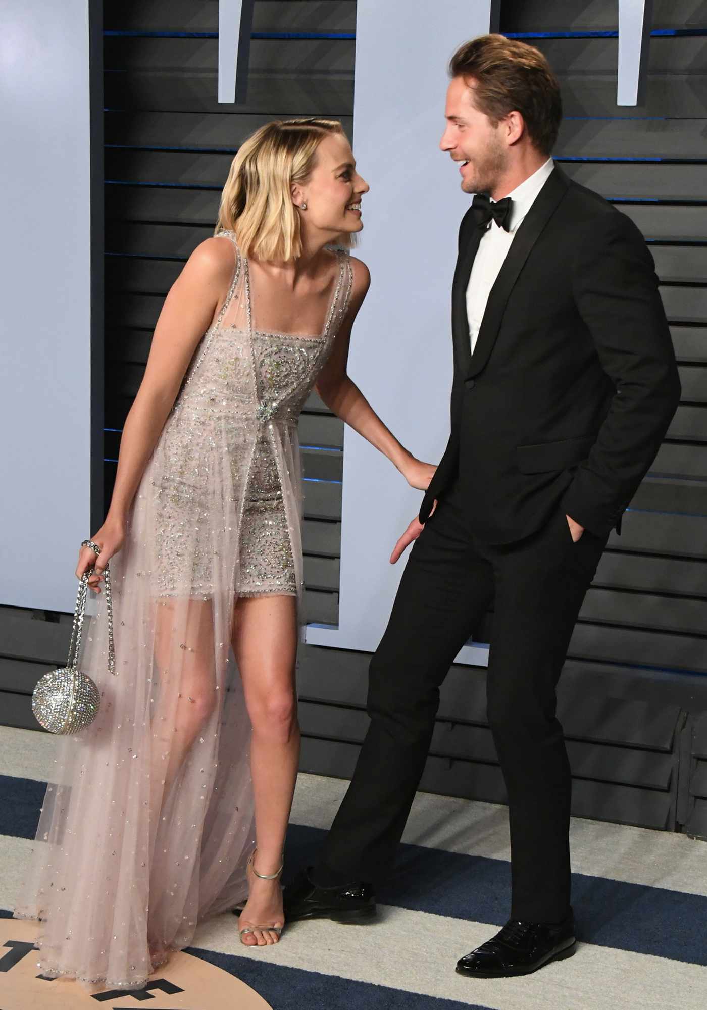 Margot Robbie (L) and Tom Ackerley attend the 2018 Vanity Fair Oscar Party hosted by Radhika Jones at Wallis Annenberg Center for the Performing Arts on March 4, 2018 in Beverly Hills, California