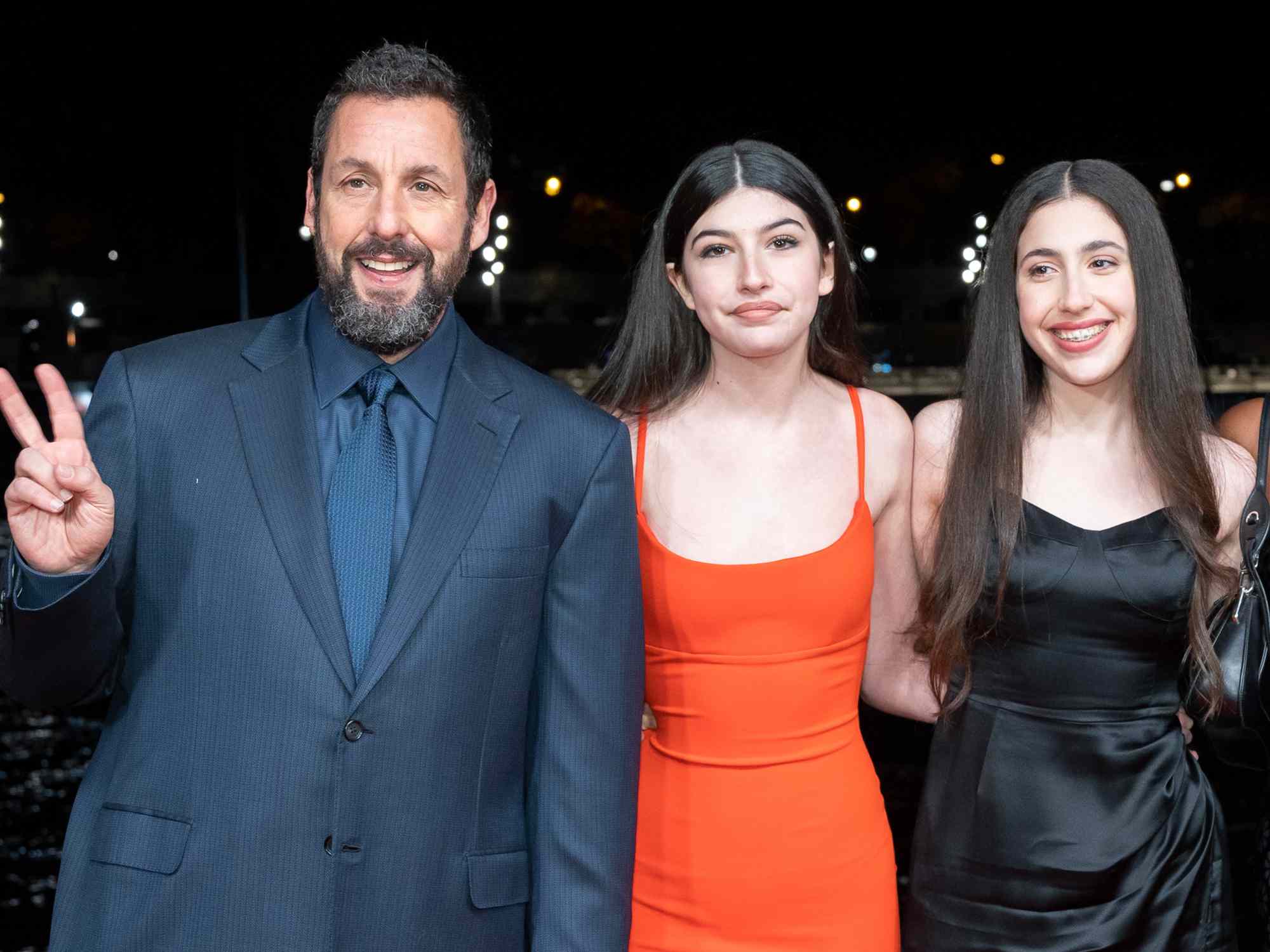 Adam Sandler, Sunny Sandler, Sadie Madison Sandler, guest and Jackie Sandler attend the "Murder Mystery 2" photocall at Pont Debilly on March 16, 2023 in Paris, France.