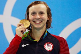 Katie Ledecky poses on the podium during the medal ceremony for the Women's 200m Freestyle Final on Day 4 of the Rio 2016 Olympic Games