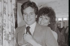 Lucie Arnaz hugs her younger brother Desi Arnaz Jr. backstage following her performance in the musical "They're Playing Our Song