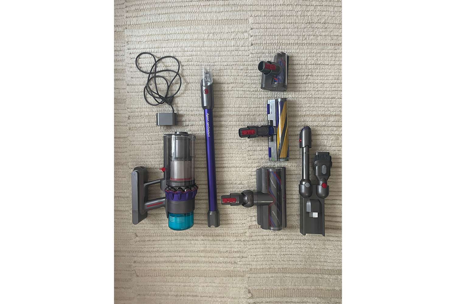 all parts of the Dyson Gen5Detect Cordless Vacuum laid out on floor