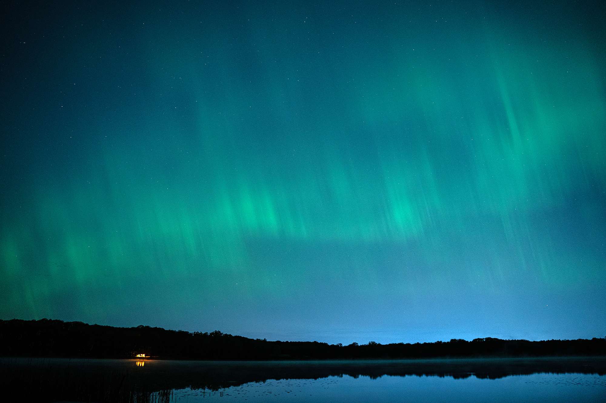 ROCHESTER, NEW YORK, UNITED STATES - MAY 11: Northern Lights (Aurora Borealis), also known as aurora, colorful lights shift, illuminate the sky in Rochester, New York, United States on May 11, 2024. 