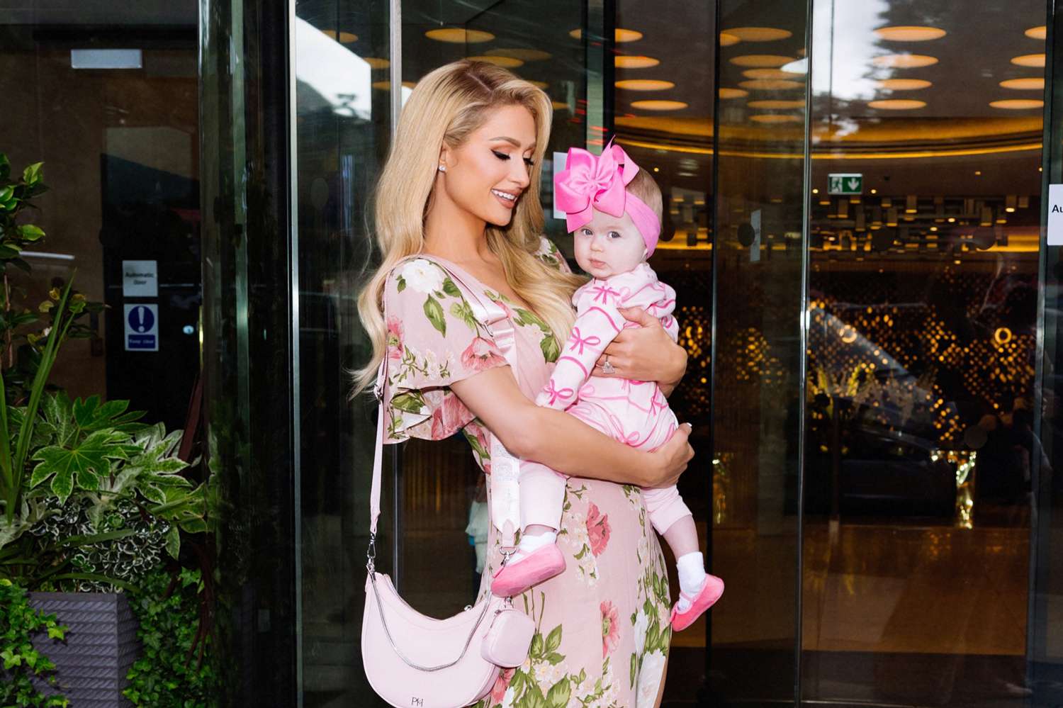 Paris Hilton Poses with Daughter London Outside the London Hilton