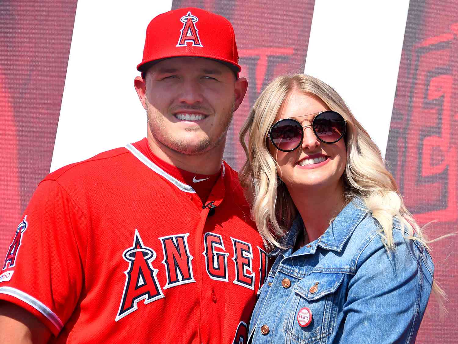 Mike Trout #27 of the Los Angeles Angels of Anaheim poses for a photo with his wife Jessica