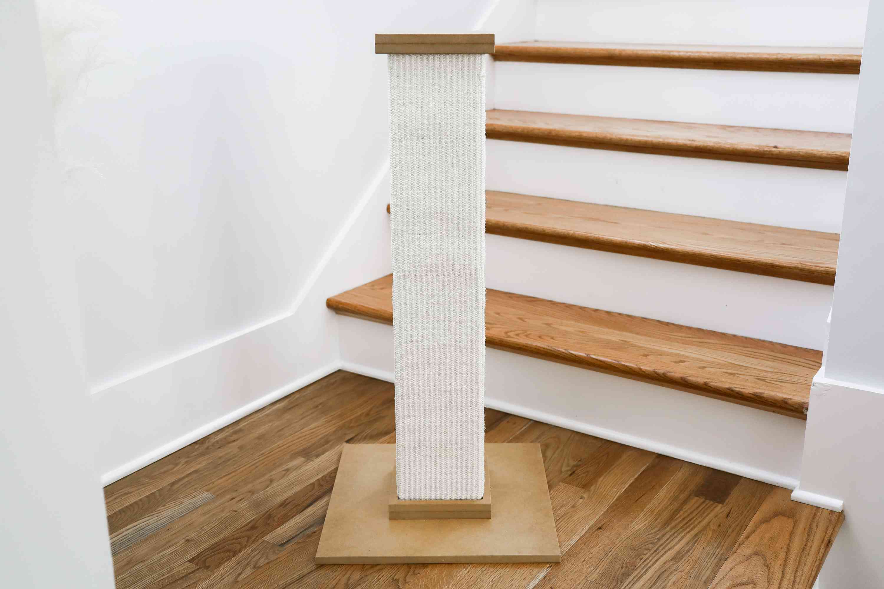 SmartCat Ultimate Scratching Post in front of staircase