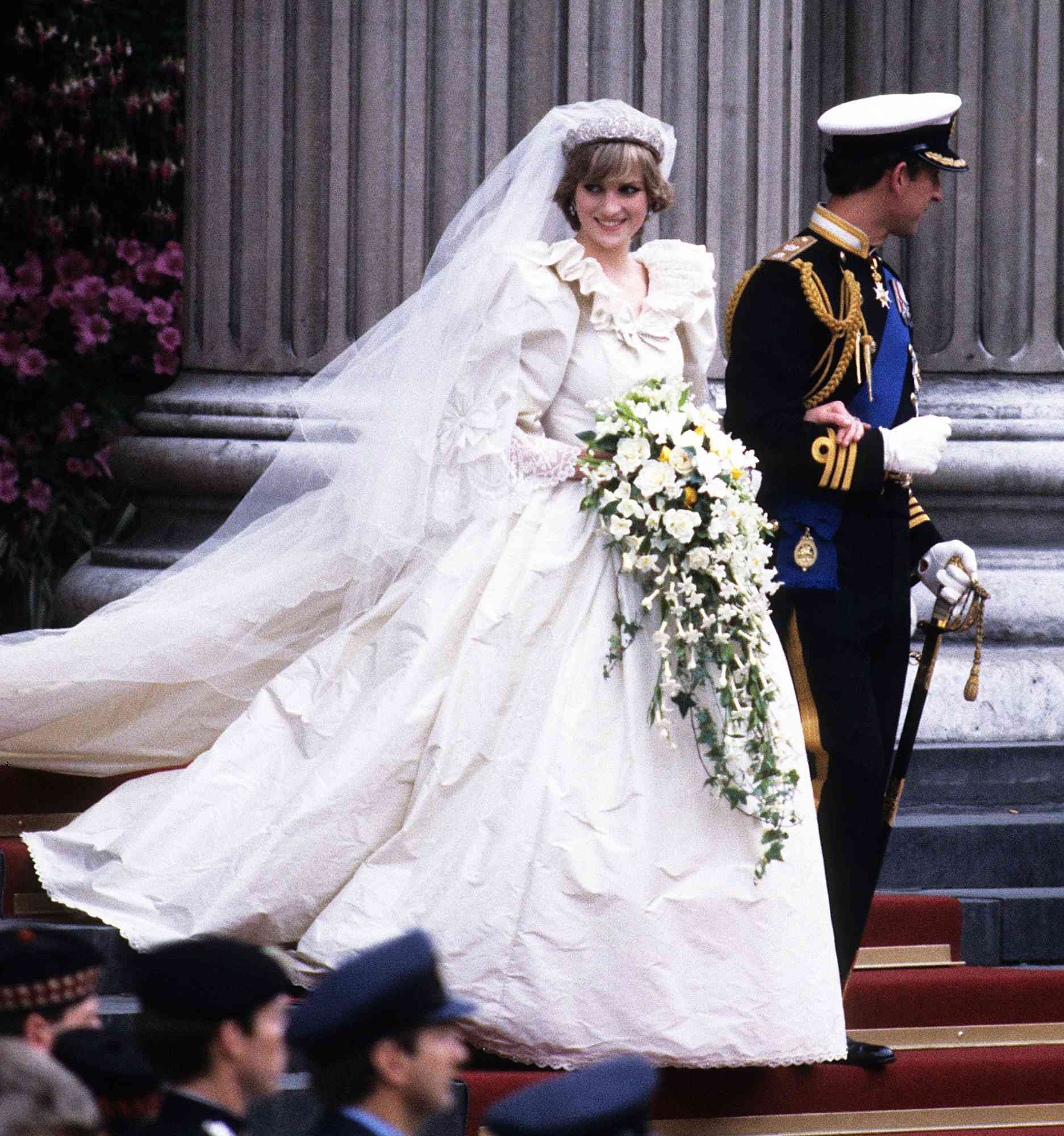 Prince Charles, Prince of Wales and Diana, Princess of Wales, wearing a wedding dress designed by David and Elizabeth Emanuel and the Spencer family Tiara, leave St. Paul's Cathedral following their wedding on July 29, 1981 in London, England