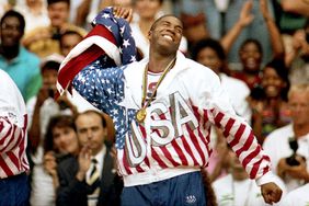 Magic Johnson of Team USA celebrates after winning the Gold medal after defeating Croatia 117-85 at the 1992 Summer Olympic games on August 8, 1992 in Barcelona, Spain.