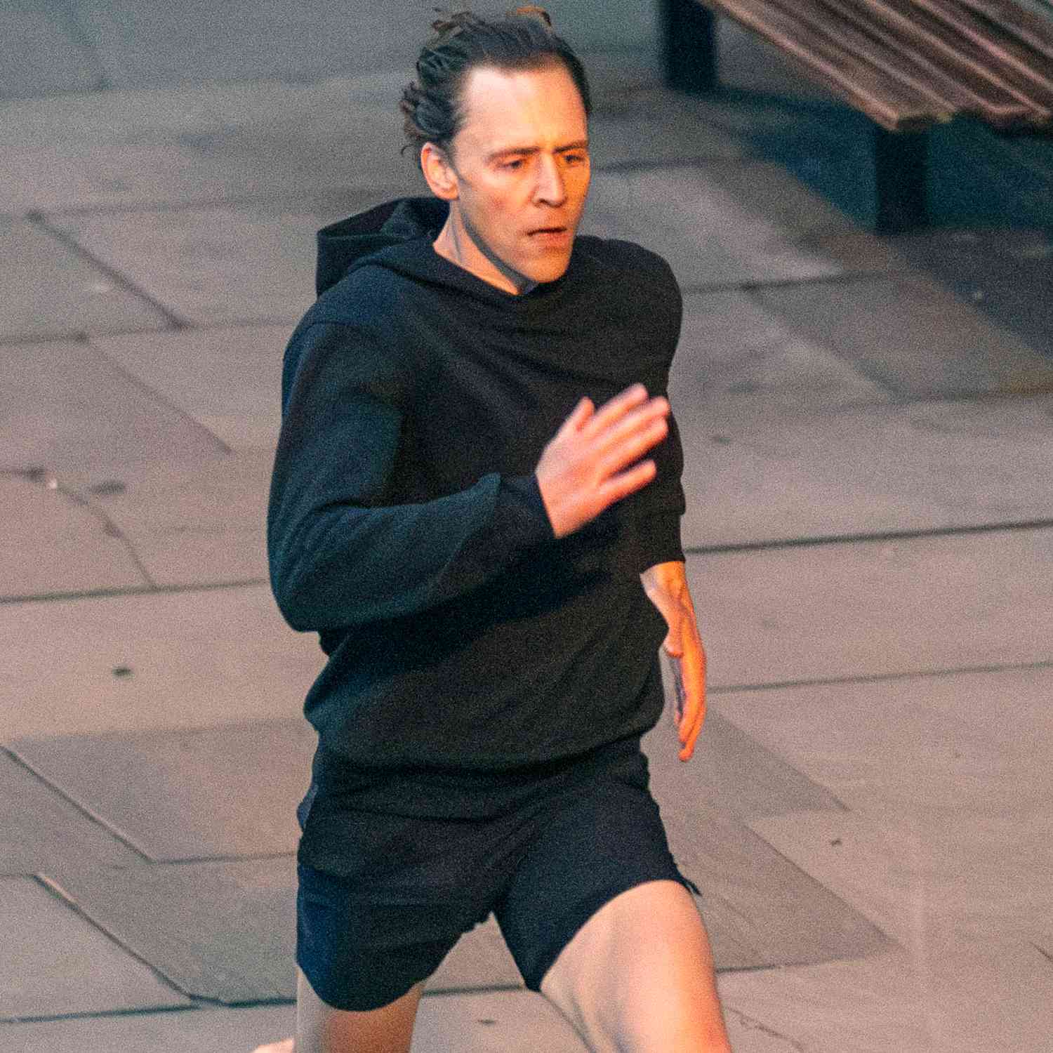 Tom Hiddleston is seen sprinting down the Southbank in London as he films scenes for The Night Manager season 2 at 