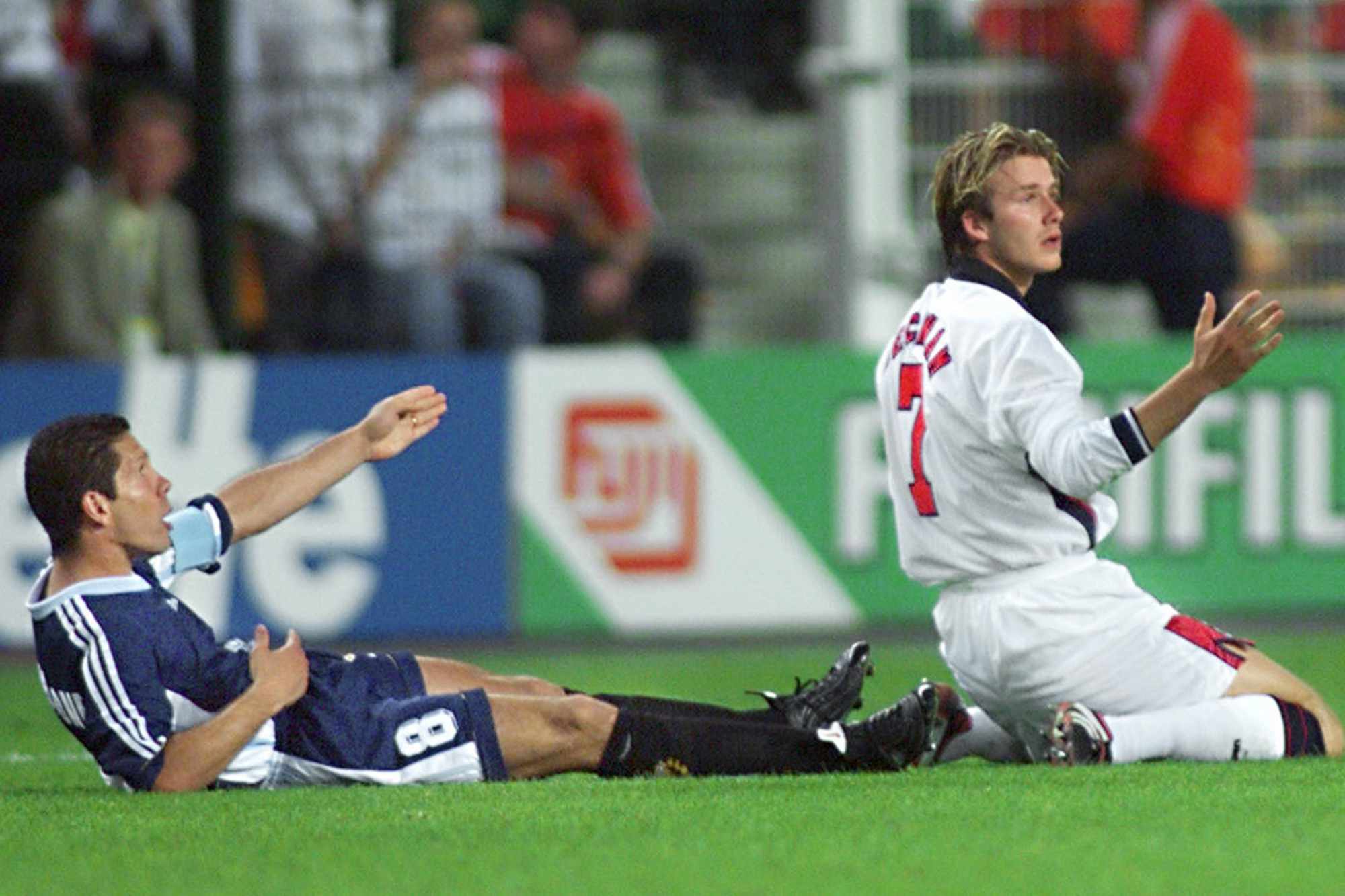 David Beckham and Diego Simeone react after foul play by Beckham during the 1998 Soccer World Cup.