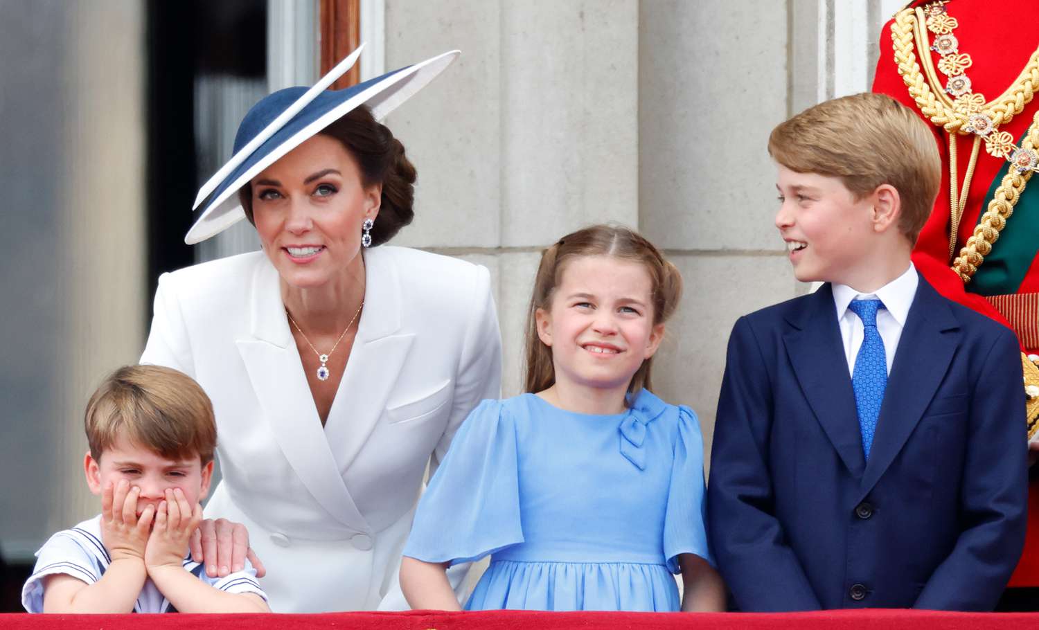 Prince Louis of Cambridge, Catherine, Duchess of Cambridge, Princess Charlotte of Cambridge and Prince George of Cambridge watch a flypast from the balcony of Buckingham Palace during Trooping the Colour on June 2, 2022 in London, England