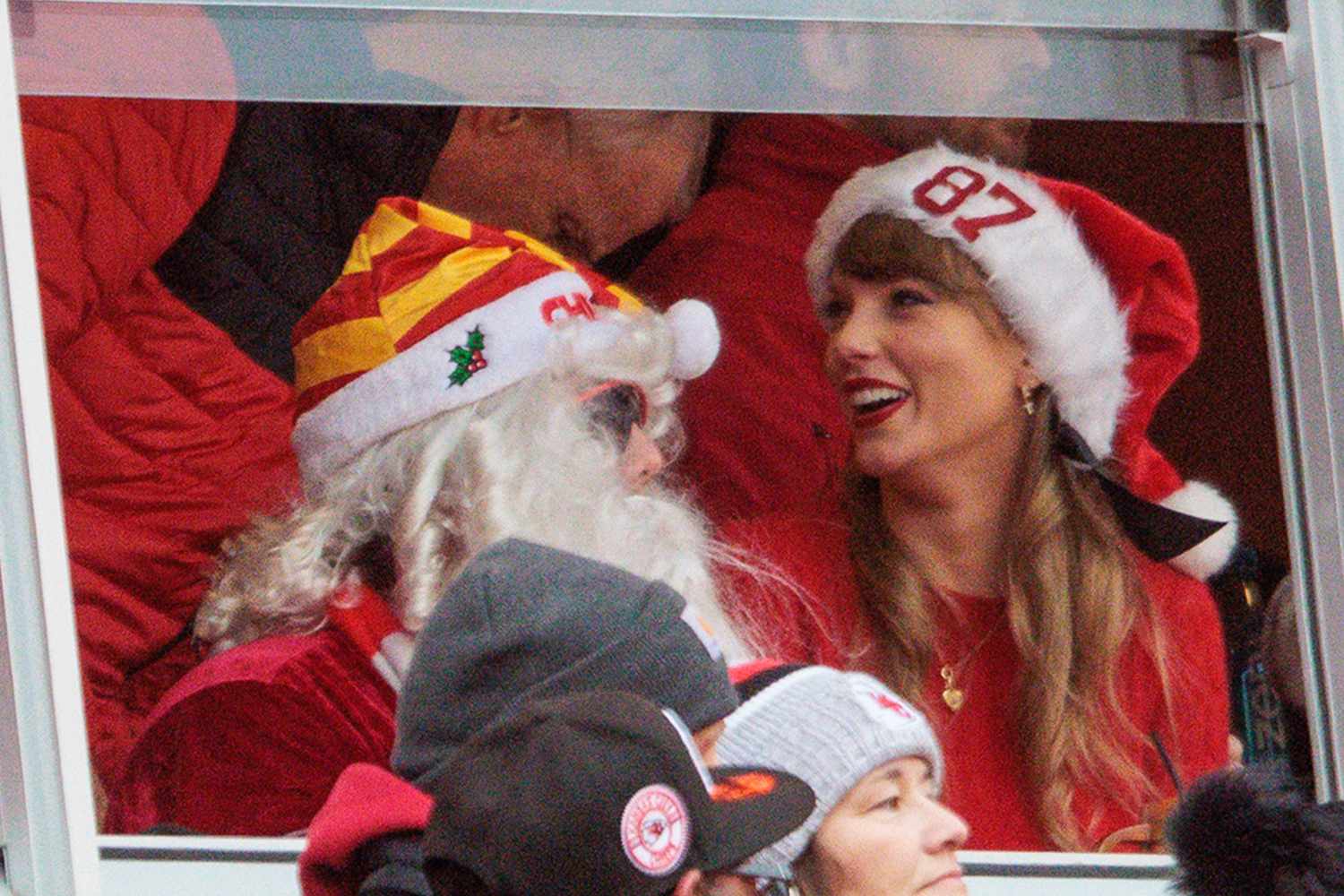 Artist Taylor Swift in the stands with an 87 Santa hat on during the game between the Kansas City Chiefs and the Las Vegas Raiders on December 25th, 2023 at Arrowhead Stadium in Kansas City, Missouri. 