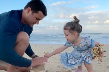 Bindi Irwin's daughter, Grace, builds a sandcastle with her husband, Chandler