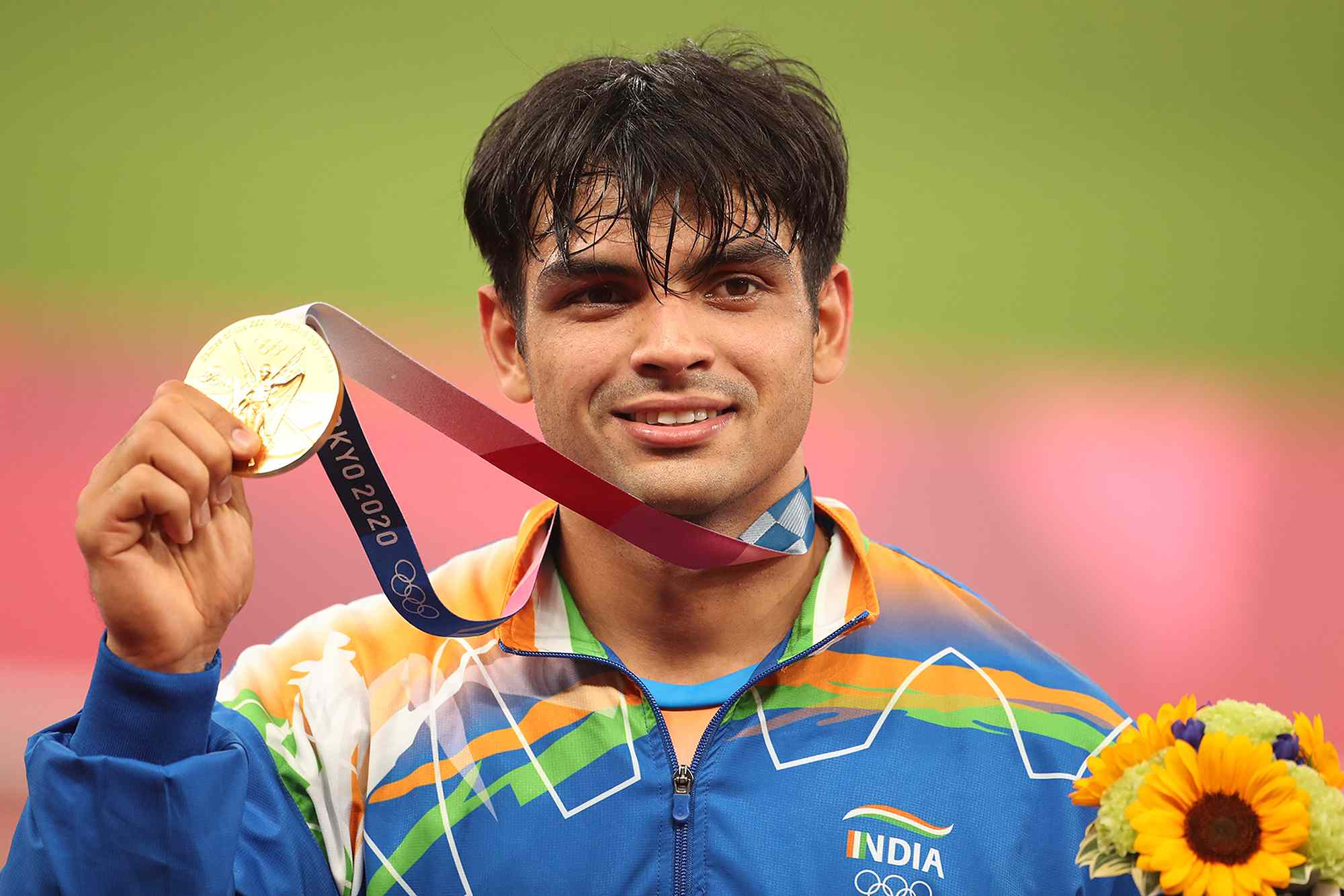 Neeraj Chopra of India on the podium at the medal presentation ceremony after winning the gold medal in the Javelin for men competition during the Track and Field competition at the Olympic Stadium at the Tokyo 2020 Summer Olympic Games on August 7th, 2021 in Tokyo, Japan. 