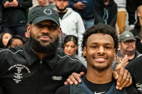 CHATSWORTH, CALIFORNIA - DECEMBER 12: (L-R) Bryce James, LeBron James, Bronny James, Carmelo Anthony and Kiyan Anthony pose together at the Sierra Canyon vs Christ The King boys basketball game at Sierra Canyon High School on December 12, 2022 in Chatsworth, California.