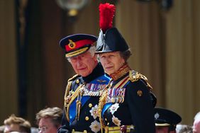 King Charles III, accompanied by Princess Anne, the Princess Royal, presents the new Sovereign's Standard to The Blues and Royals during a ceremony at Buckingham Palace on June 15, 2023 in London, England. The regiment will provide the Sovereign's Escort at Trooping The Colour on Saturday