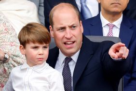 Prince Louis of Cambridge sits on his father Prince William, Duke of Cambridge's lap as they attend the Platinum Pageant on The Mall on June 5, 2022 in London, England.