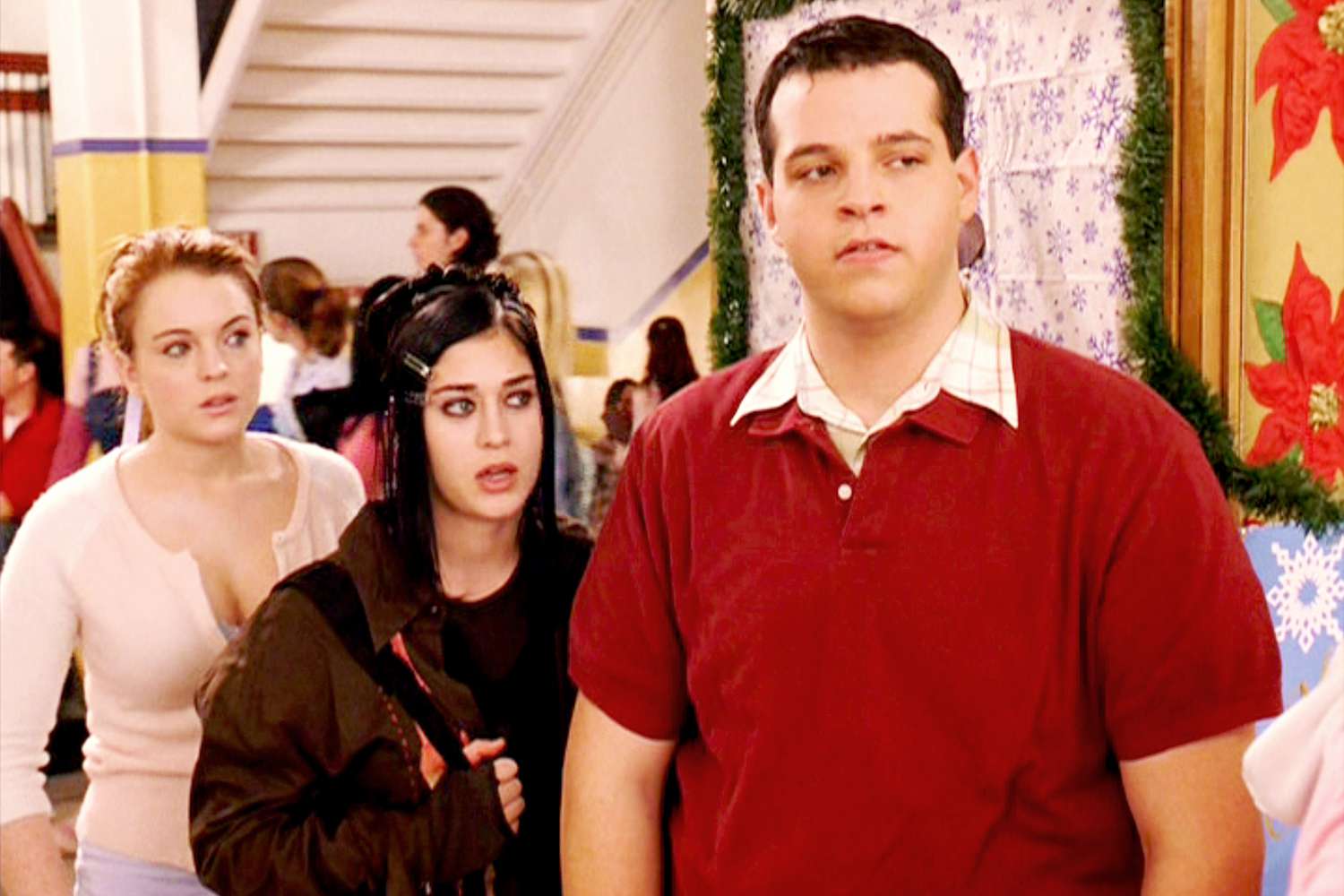 The movie "Mean Girls", directed by Mark Waters. Seen here from left, Lindsay Lohan (as Cady Heron), Lizzy Caplan (as Janis Ian) and Daniel Franzese (as Damian)