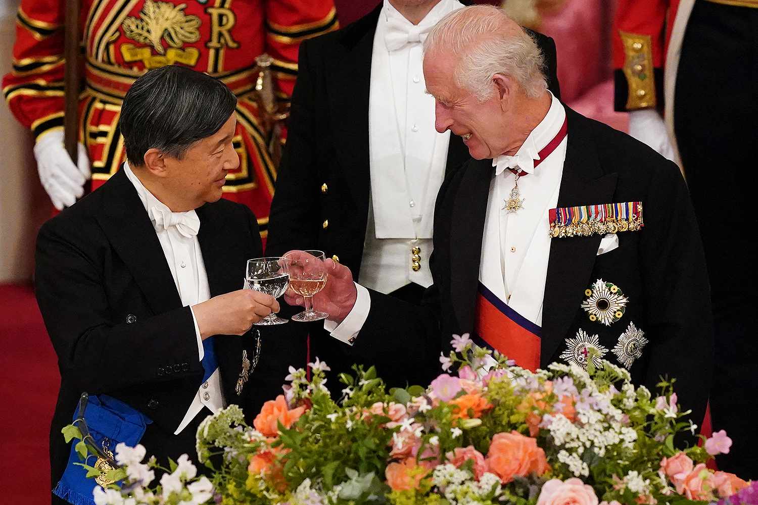 Britain's King Charles III (R) and Japan's Emperor Naruhito attend a State Banquet at Buckingham Palace in London on June 25, 2024, on the first day of their three-day State Visit to Britain.