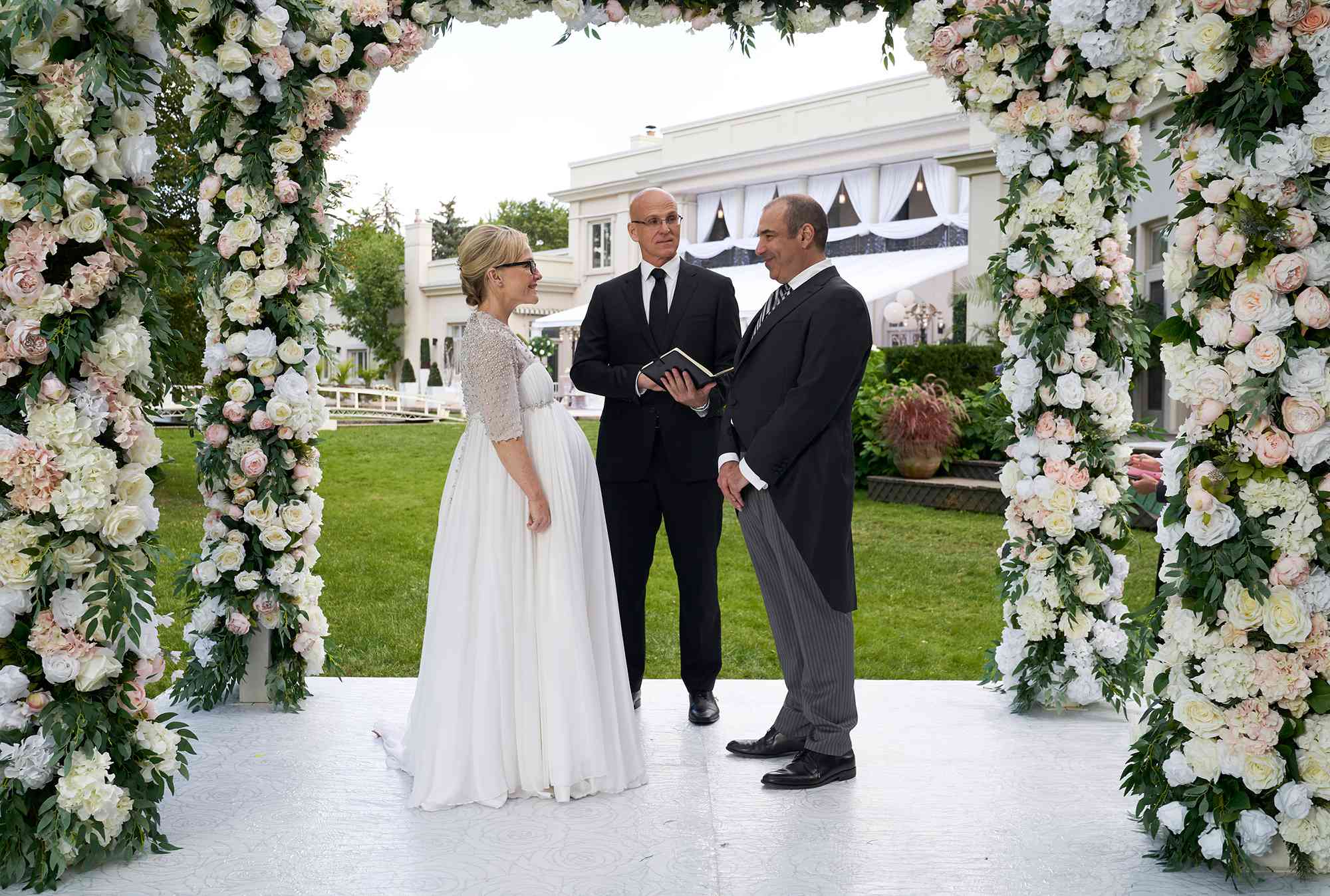 Rachael Harris as Shelia Sazs, Ray Proscia as Dr. Stan Lipschitz, and Rick Hoffman as Louis Litt on 'Suits'.