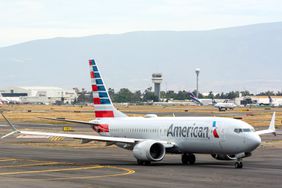 An American Airlines aircraft taxiing on a sunny runway