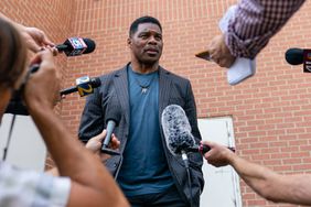 Herschel Walker, US Republican Senate candidate for Georgia, speaks to members of the media following a campaign rally in Macon, Georgia, US, on Wednesday, May 18, 2022. Heisman Trophy-winner Walker is vying to face incumbent Democratic Senator Raphael Warnock in his first political run.