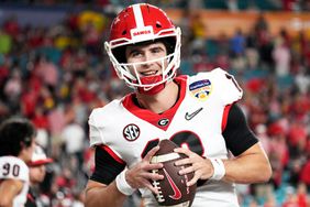 Stetson Bennett #13 of the Georgia Bulldogs warms up before the game against the Michigan Wolverines in the Capital One Orange Bowl for the College Football Playoff semifinal game at Hard Rock Stadium on December 31, 2021 in Miami Gardens, Florida.